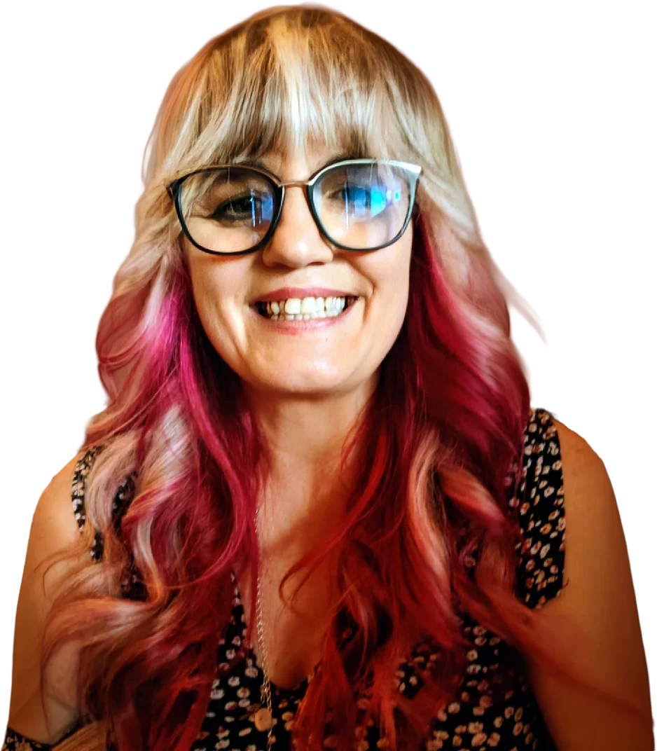Lisa Snyman, Mrs. S, smiling, with glasses and long pink-tipped hair